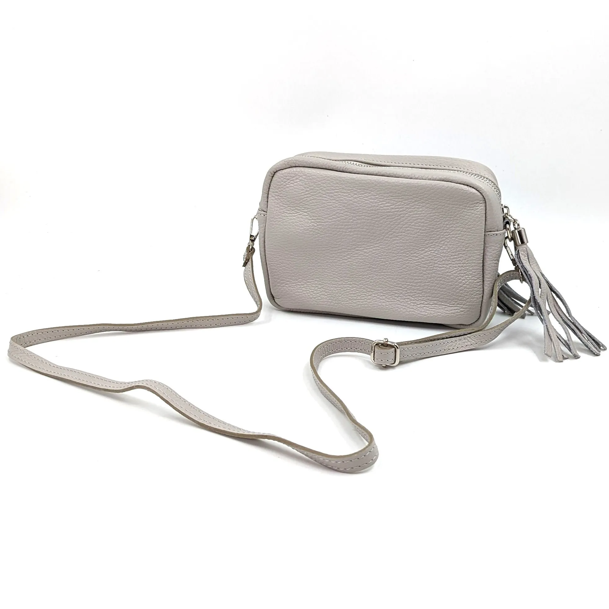 Boxy leather bag with tassel and crossbody strap