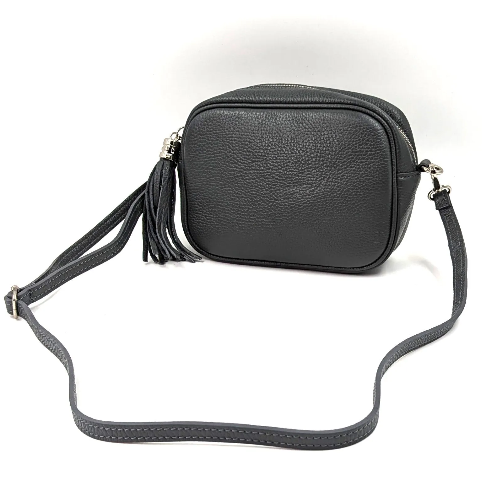 Boxy leather bag with tassel and crossbody strap