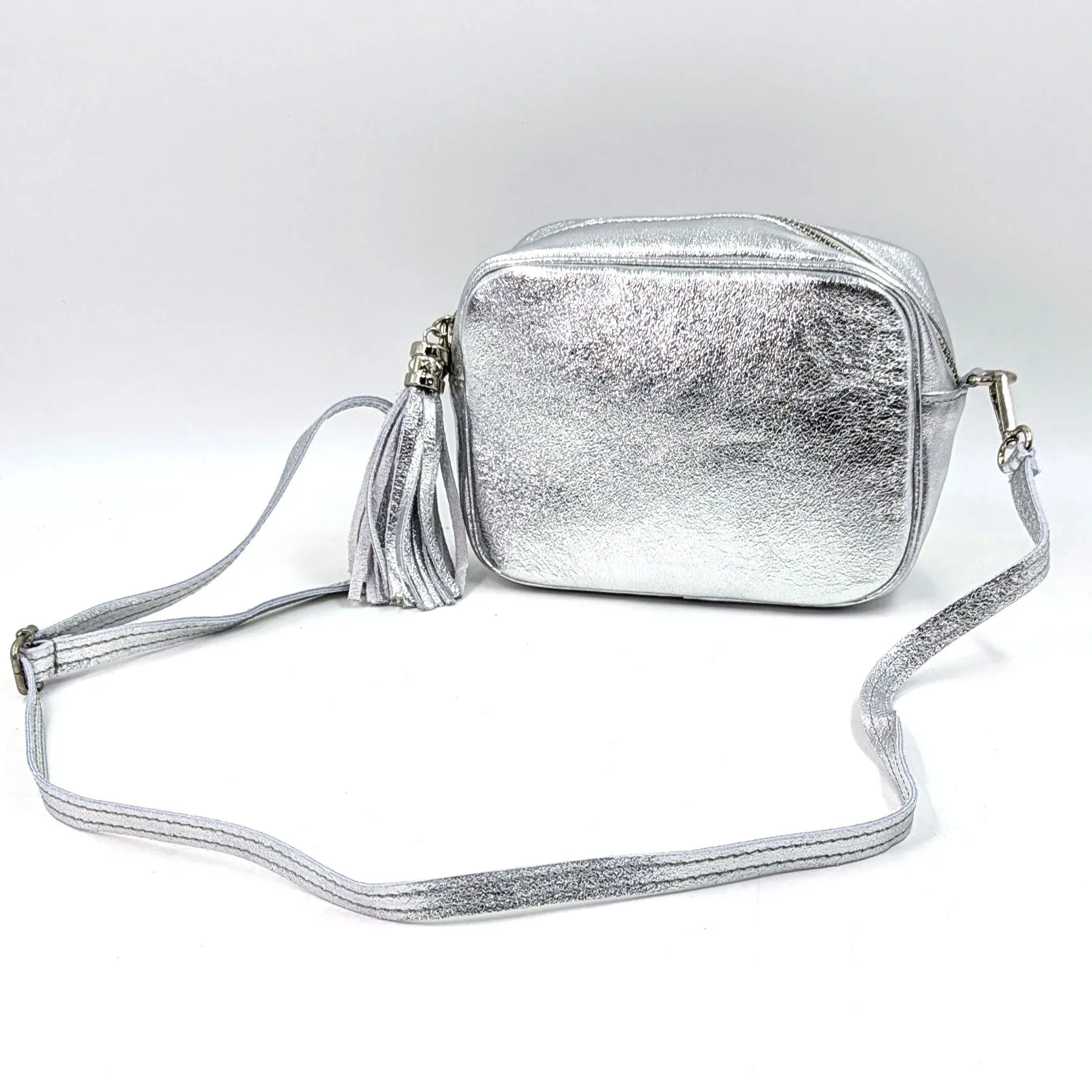 Boxy leather bag with tassel and crossbody strap