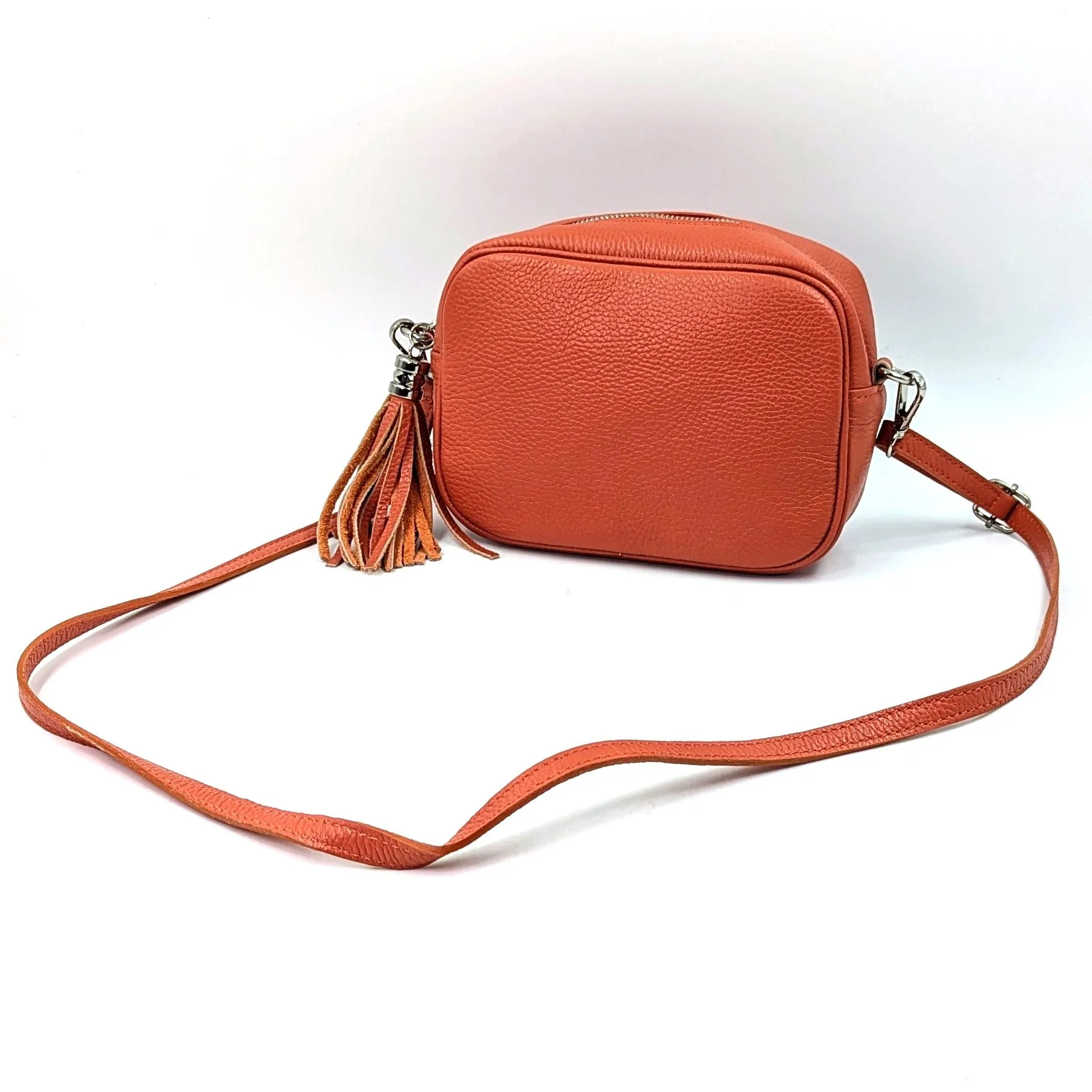 Boxy leather bag with tassel and crossbody strap