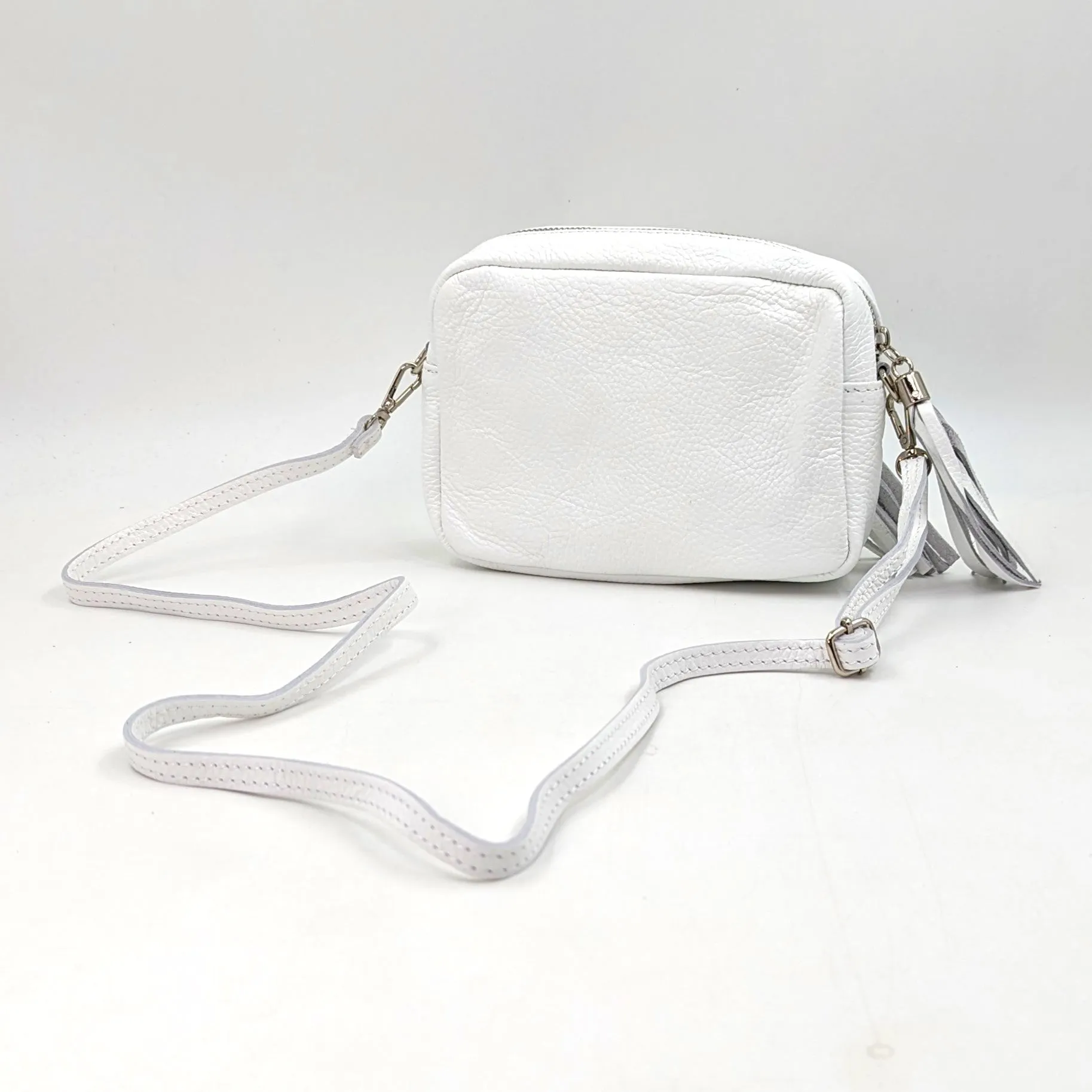 Boxy leather bag with tassel and crossbody strap